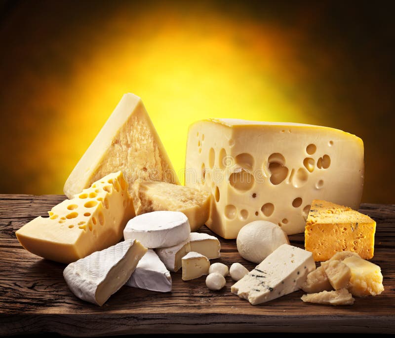 Different types of cheese on old wood. royalty free stock image
