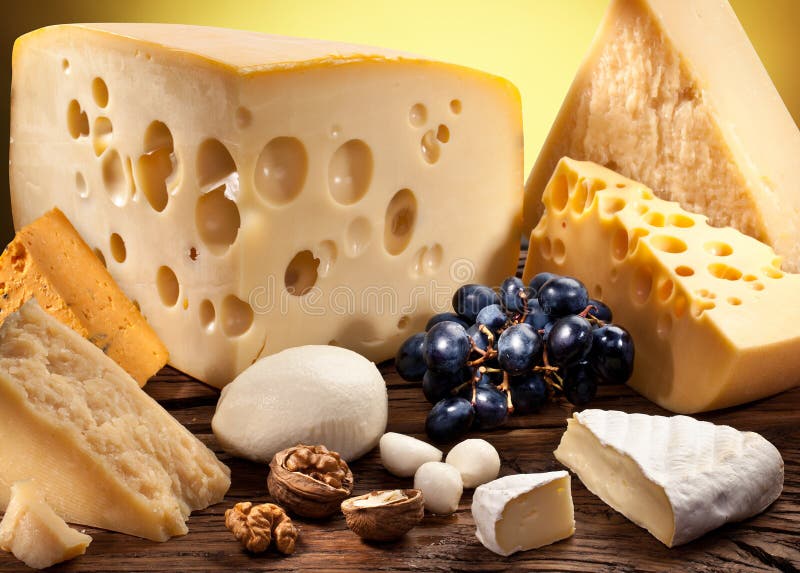 Different types of cheese on old wooden. royalty free stock photography
