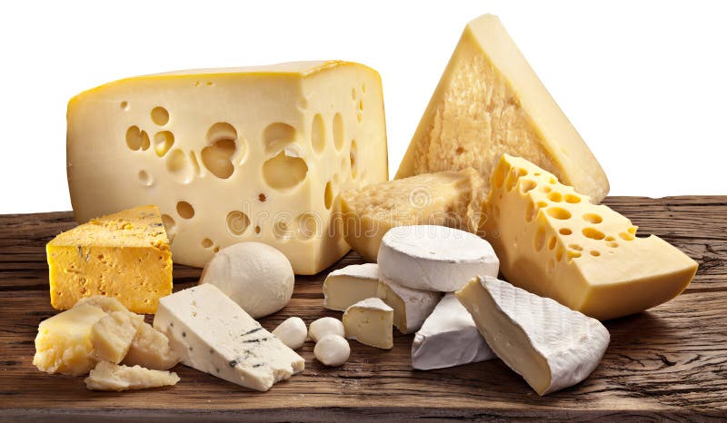 Different types of cheese over old wooden table. stock photos