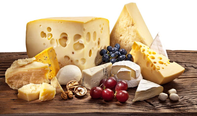 Different types of cheese over old wooden table. royalty free stock photos