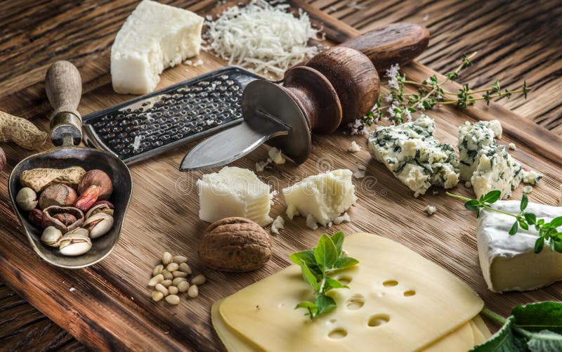 Different Types of Cheeses with Nuts and Herbs. Stock Image Image of