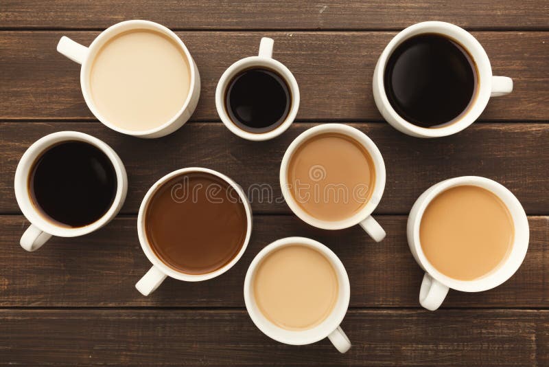 Different Types of Coffee in Cups on Wooden Table, Top View Stock Image