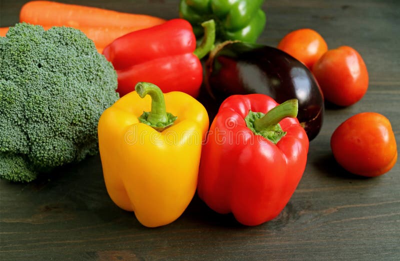 Different Types of colorful fresh vegetables on wooden table