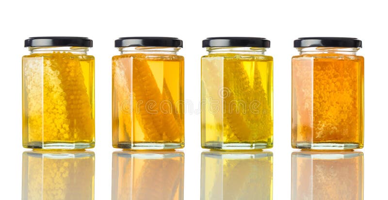 Different Types of Honey in Jar on White royalty free stock photography