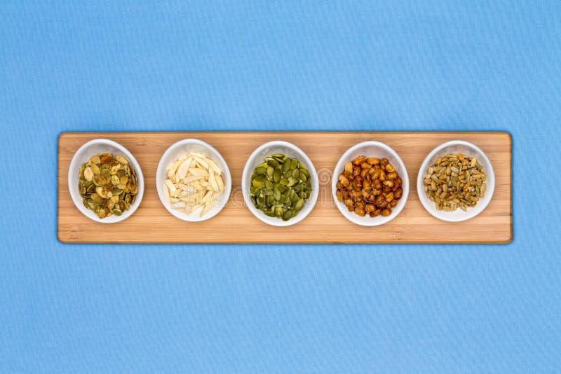 Different types of nuts presented in tater cups royalty free stock photography