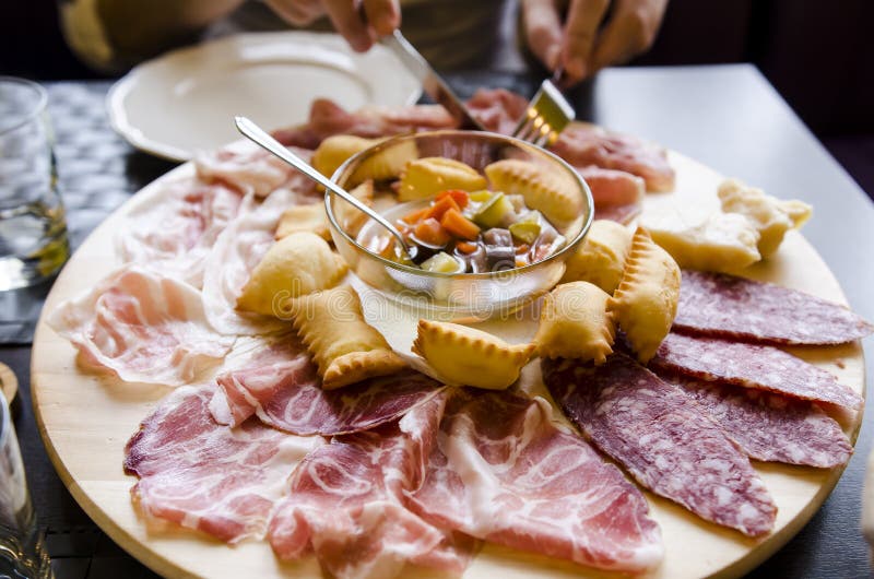 Different types of prosciutto and salami royalty free stock photo