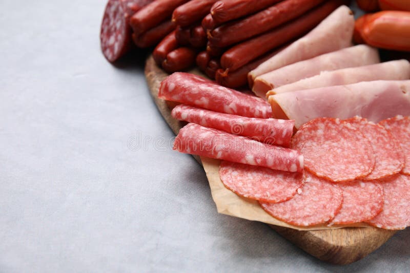 Different Types of Sausages on Light Grey Table, Closeup. Space for