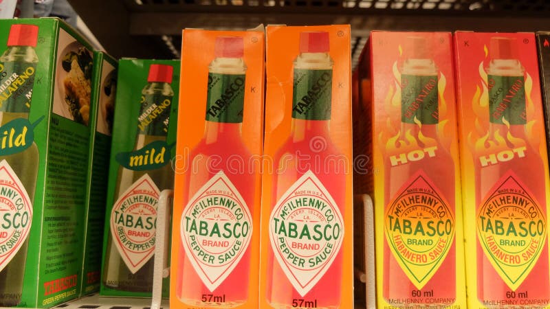 Different variety of Tabasco sauce in a grocery store shelf. Tabasco sauce, is a proprietary, liquid spicy sauce made from ripe, m