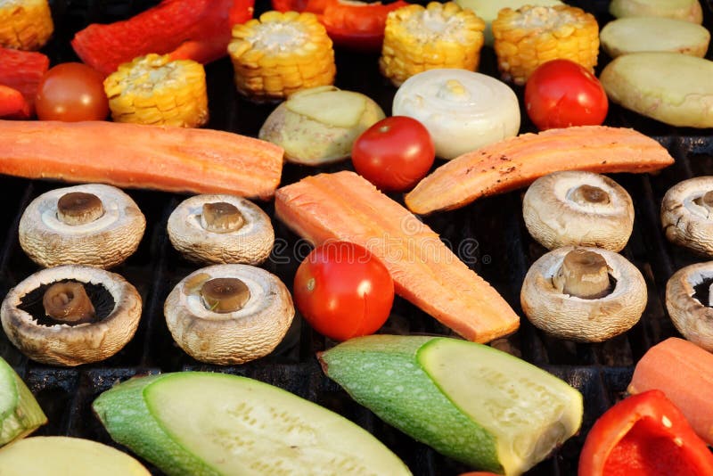 Different Vegetables Mix on the Hot BBQ Grill Background Stock Photo