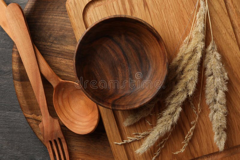 Different Wooden Kitchenware on Wooden Table, Space for Text Stock