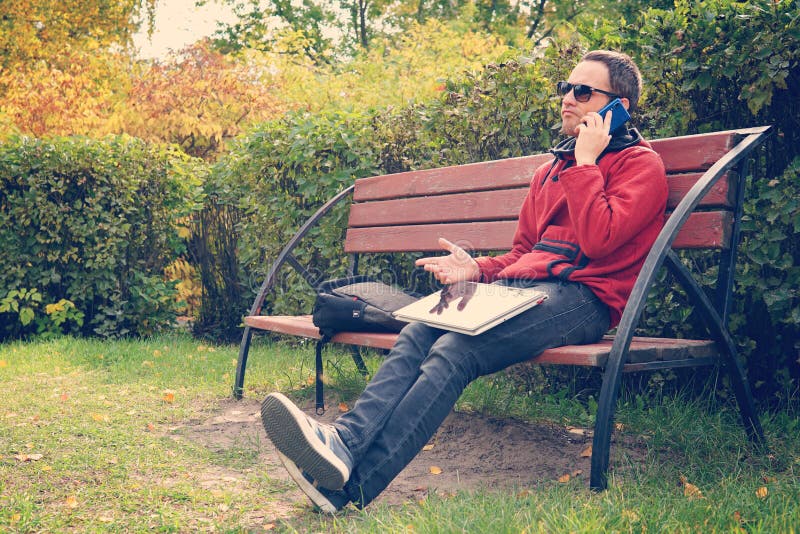 Difficult business conversation on the phone, solving problems at work. dissatisfied man working on laptop computer royalty free stock photos Difficult business conversation on the phone, solving problems at work. dissatisfied man working on laptop computer royalty free stock photos