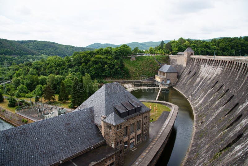 Image of the water dam in Edersee / Edertal, Germany. It is the third largest and one of the oldest dams in Germany. It was built from 1908 to 1914 and destroyed by bombs in the year 1943 in the second world war. It was rebuilt in the same year by forced laborers. Image of the water dam in Edersee / Edertal, Germany. It is the third largest and one of the oldest dams in Germany. It was built from 1908 to 1914 and destroyed by bombs in the year 1943 in the second world war. It was rebuilt in the same year by forced laborers.