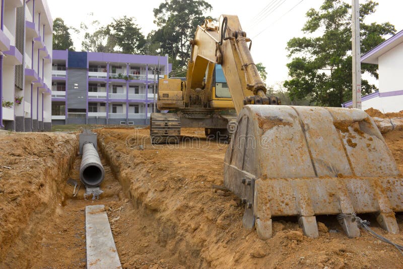 Digging drains to prevent flooding stock image