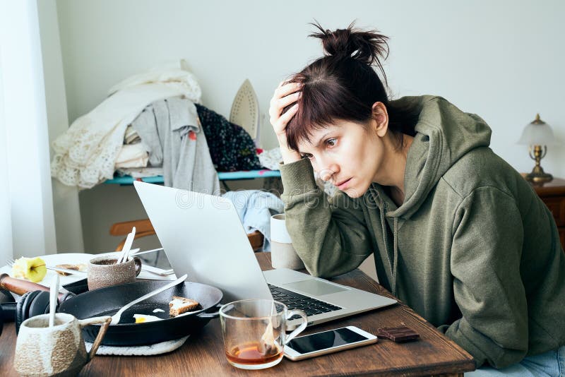Digital addiction, woman in panic reads articles about coronavirus on Internet