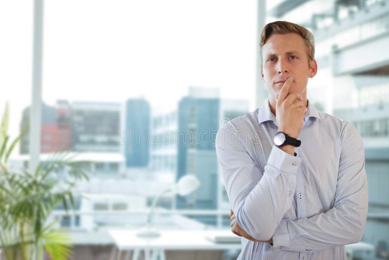 Business man thinking against office background