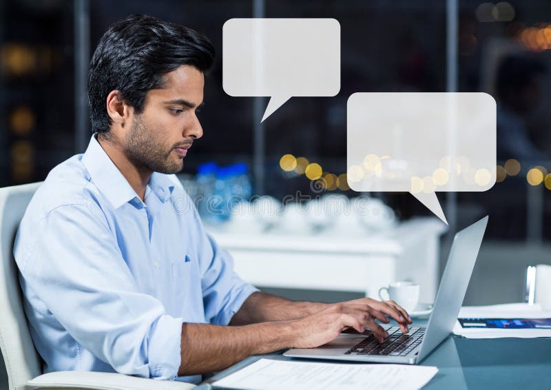 Digital composite of Man on laptop working late with empty chat bubbles