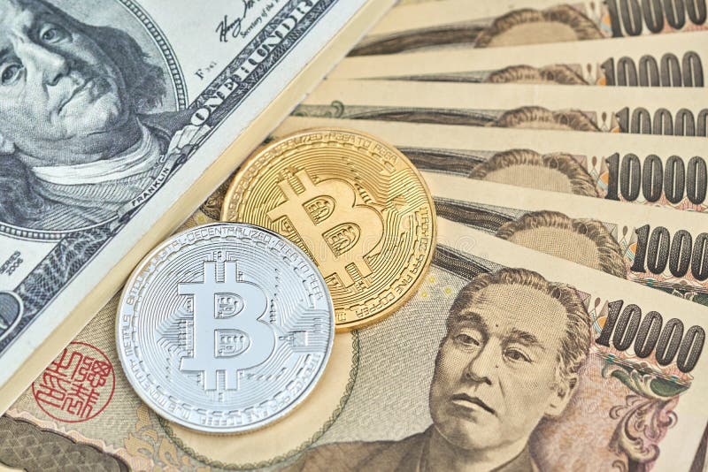The digital currency Bit coin is made of silver and gold. Place Japanese bank notes and American banknotes dollars. using as b royalty free stock photography The digital currency Bit coin is made of silver and gold. Place Japanese bank notes and American banknotes dollars. using as b royalty free stock photography