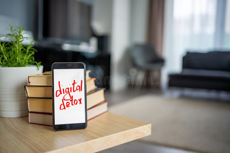 Digital detox concept. In the foreground is a smartphone with the text Digital Detox. High quality photo. Digital detox concept. In the foreground is a smartphone with the text Digital Detox. High quality photo