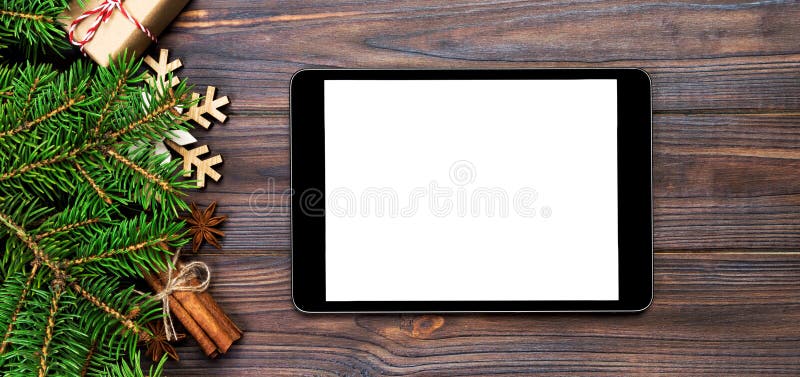 Digital tablet mock up with rustic Christmas wood background decorations for app presentation. top view banner with copy space royalty free stock photos Digital tablet mock up with rustic Christmas wood background decorations for app presentation. top view banner with copy space royalty free stock photos