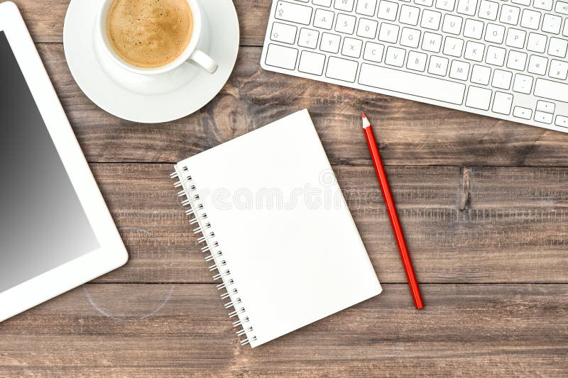 Digital tablet pc, keyboard and cup of coffee. Home office workplace royalty free stock photo