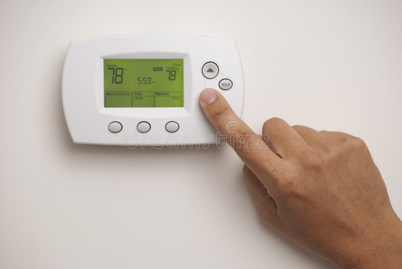 Digital Thermostat and male hand royalty free stock photography