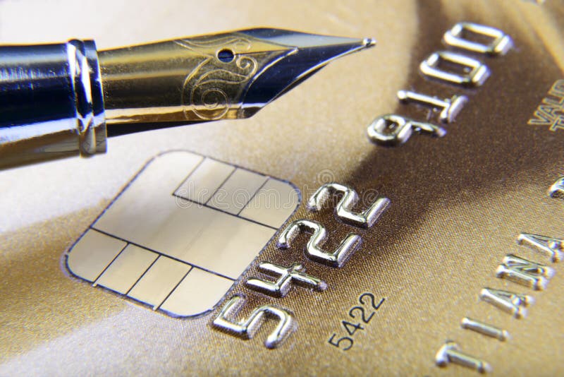 Digits and pen on credit card close-up