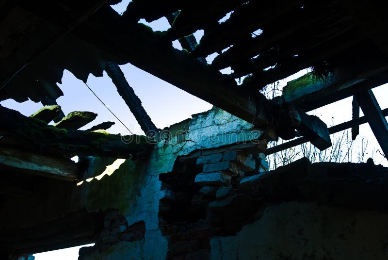 Dimly-lit dilapidated barn