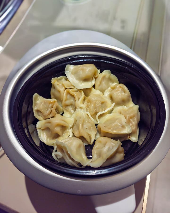 Dimsum being reheated in rice cooker at home. Dimsum restaurant stock images, royalty-free photos and pictures