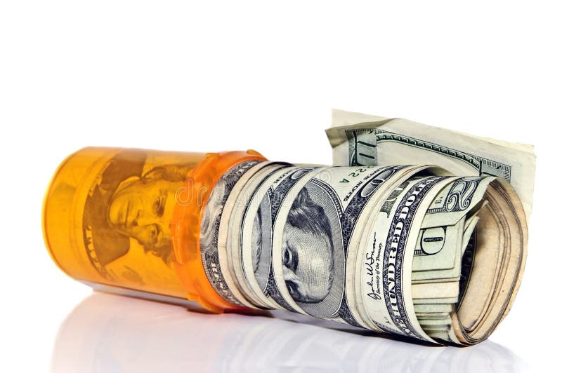 A prescription pill bottle with rolls of cash in it. Concept or metaphor for cost of drugs. A prescription pill bottle with rolls of cash in it. Concept or metaphor for cost of drugs.