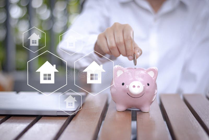 Dinheiro de salvamento para comprar no futuro um conceito dos bens imobiliários da casa fotografia de stock Dinheiro de salvamento para comprar no futuro um conceito dos bens imobiliários da casa fotografia de stock