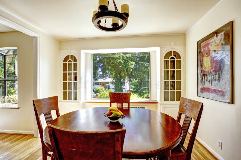 Nice Dining Area with Round Table and Green Chairs. Stock Image Image