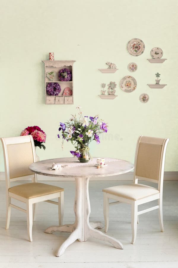 Dining Room Interior with Flowers Decorative Plates Blue Wall an Stock