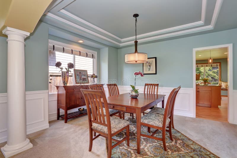 Dining Room Interior With Mint Walls And Coffered Ceiling Stock