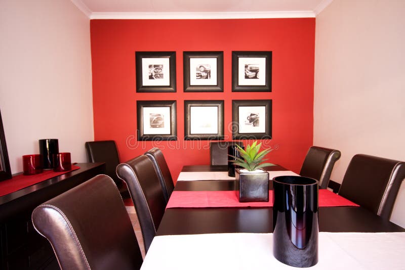 Dining room with red walls stock photo. Image of design 12627114