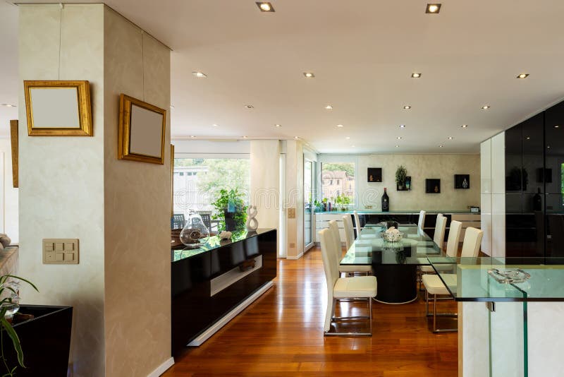 Dining Room with Leather Chairs, Glass Table and Parquet Stock Image