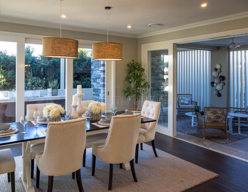 Dining room next to out door room looking out outside to BBQ grill royalty free stock photos Dining room next to out door room looking out outside to BBQ grill royalty free stock photos