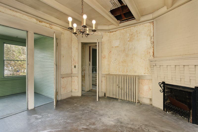 Dining room with peeling paint in old abandoned home. Dilapidated architecture stock images, royalty-free photos and pictures