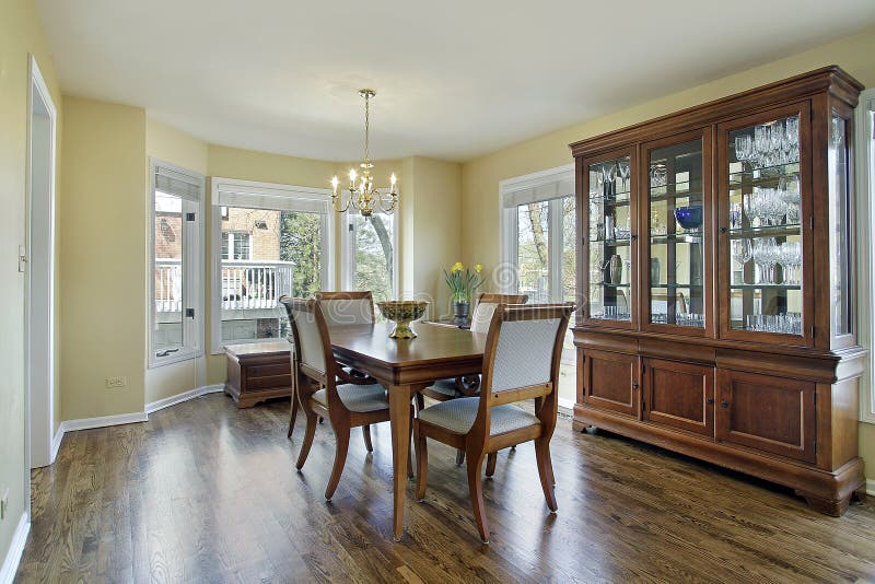 Charming Dining Room with Glass Dining Table and Wicker Rustic C Stock