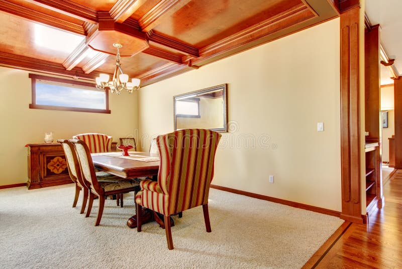 Dining Room with Yellow Walls and Wood Ceiling. Stock Image Image of
