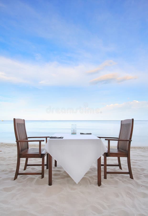 Dining table on the beach stock photo. Image of nature 27328764