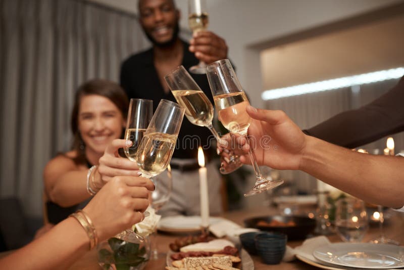 Dinner party, friends and cheers with wine glass for celebration, social gathering or new years event at home. Happy