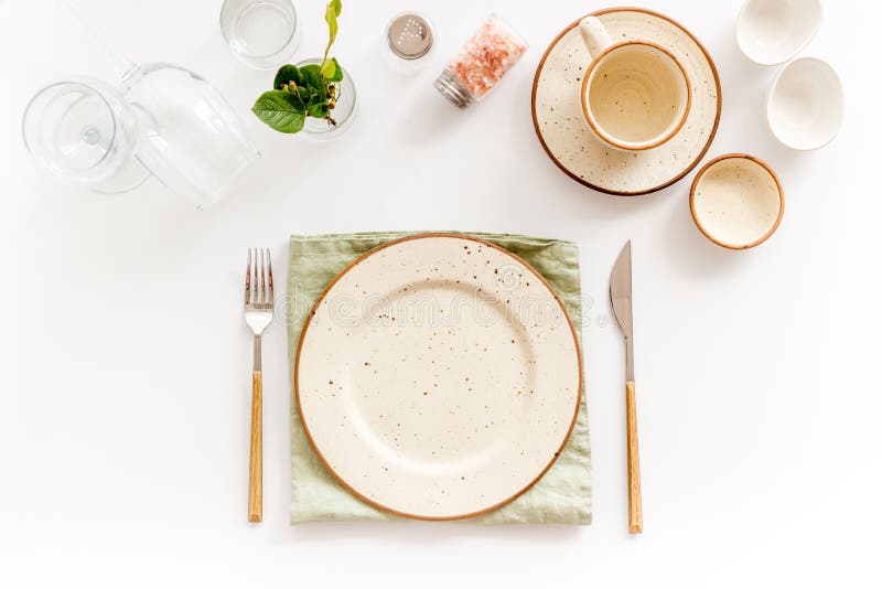 Dinner Plate Setting with Cutlery and Napkin. Top View Stock Photo