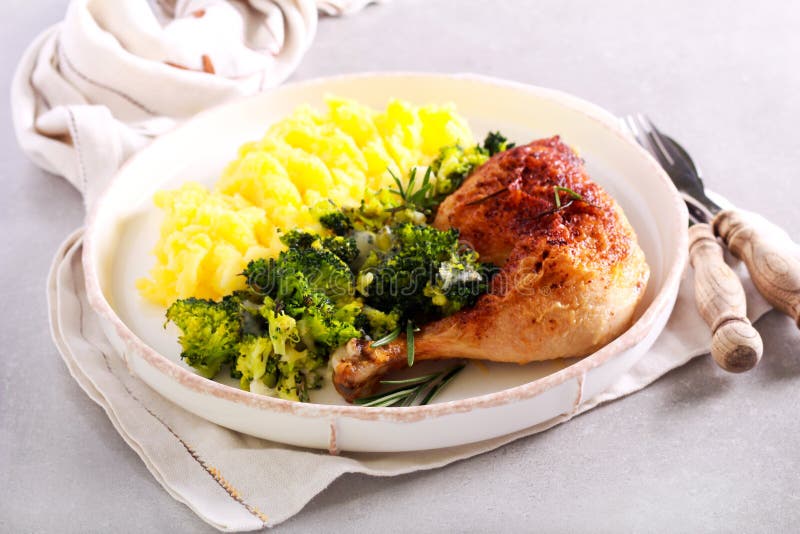 Dinner Rosemary Chicken Leg with Broccoli and Mashed Potato Stock