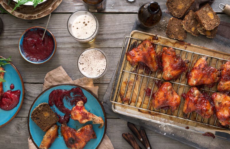 Dinner Table with Chicken Wings and Beer Stock Photo Image of rustic