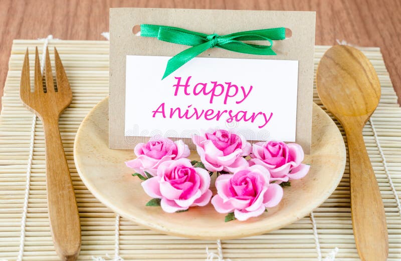 Dinner Table Setting with Happy Anniversary Message Card Stock Photo