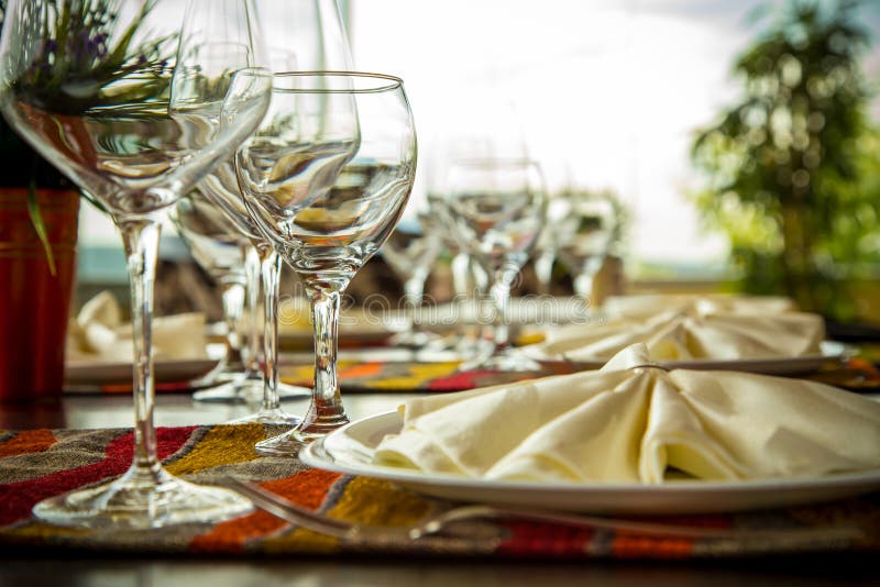 Elegance shot of fine dinning set in hotel restaurant. Vacation and leisure theme. Elegance shot of fine dinning set in hotel restaurant. Vacation and leisure theme.