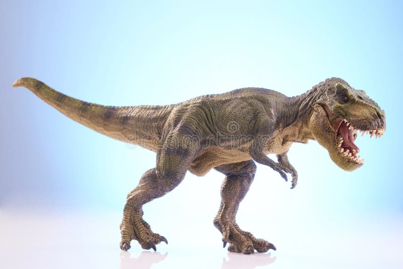 Shooting dinosaur model on blue background