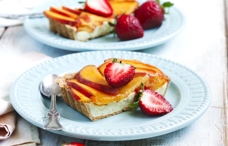 Tart with cream Diplomat, fresh peaches and strawberry. Tart with cream Diplomat, fresh peaches and strawberry