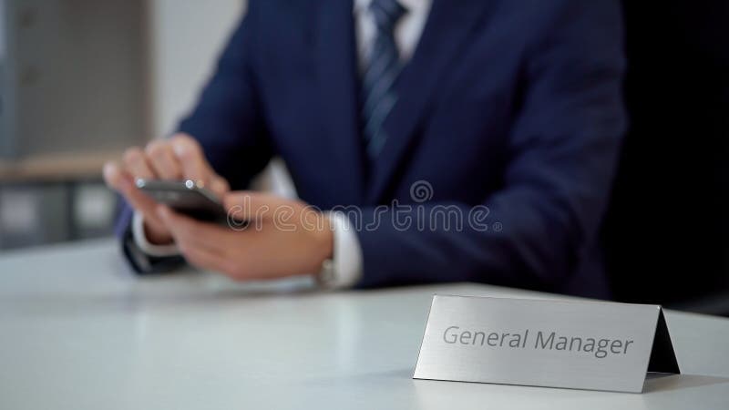 Male general manager of corporation reading business e-mail on smartphone, stock photo. Male general manager of corporation reading business e-mail on smartphone, stock photo