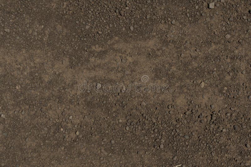 Dirt floor texture with pebbles stock photography